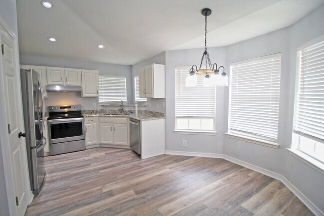 Building Photo - Updated Fox Hollow 3BR Home Near 9 Mile Rd with LVP Flooring, Granite Kitchen, 2-Car Garage & Fen...