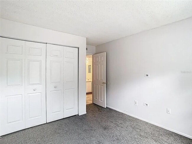 Building Photo - 2BR Condo Near UCF – All-Inclusive Living & Resort Amenities!