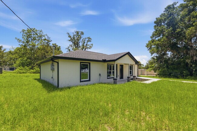 Building Photo - Available Now! New 3/2 Home with Large Backyard and Front Porch