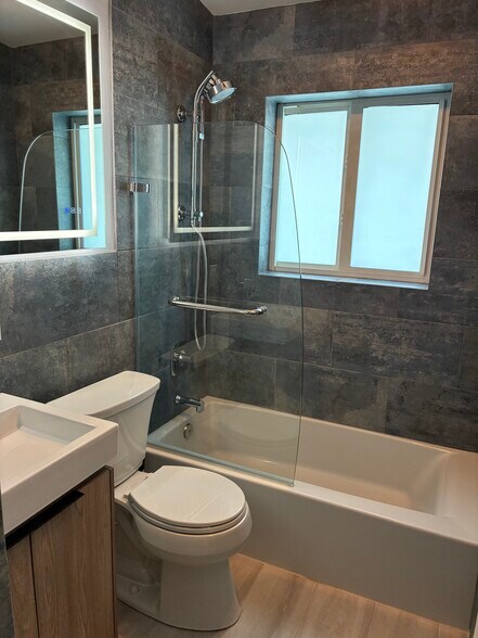 Updated bathroom. - 1041 Hillsboro Mile