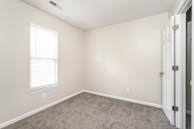 Building Photo - 5209 Carriage Woods Dr