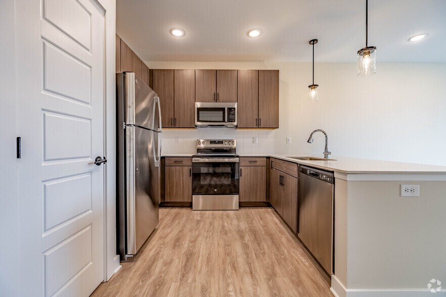 1BR, 1BA - 843SF - Kitchen - The District at Deerfield Residences
