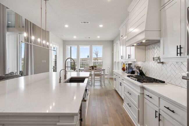 Building Photo - Stunning 4-Bedroom Luxury Residence with Bonus Office in the Prestigious Walsh Community LIKE NEW!