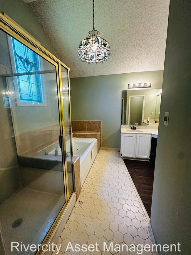 Building Photo - charming three-bedroom, two-full-bath resi...