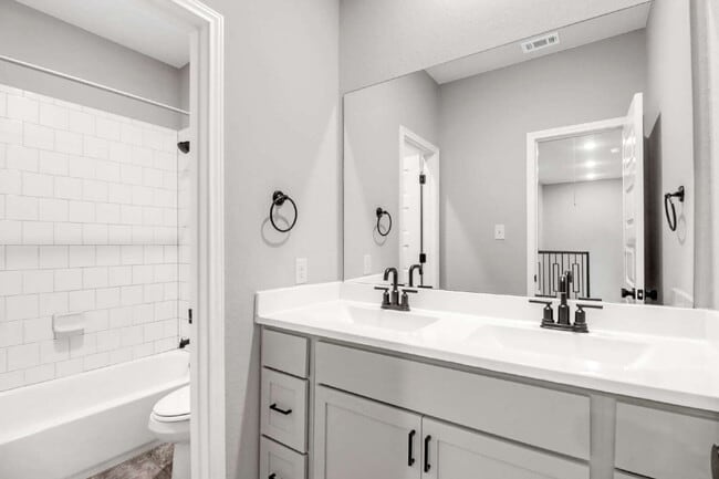 Building Photo - "Spacious 4-Bedroom Sanctuary with Cozy Fireplace in San Antonio's Prime Location!"