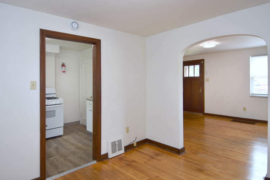 Kitchen right off dining area with all new luxury vinyl plank flooring - 210 E Garden Rd