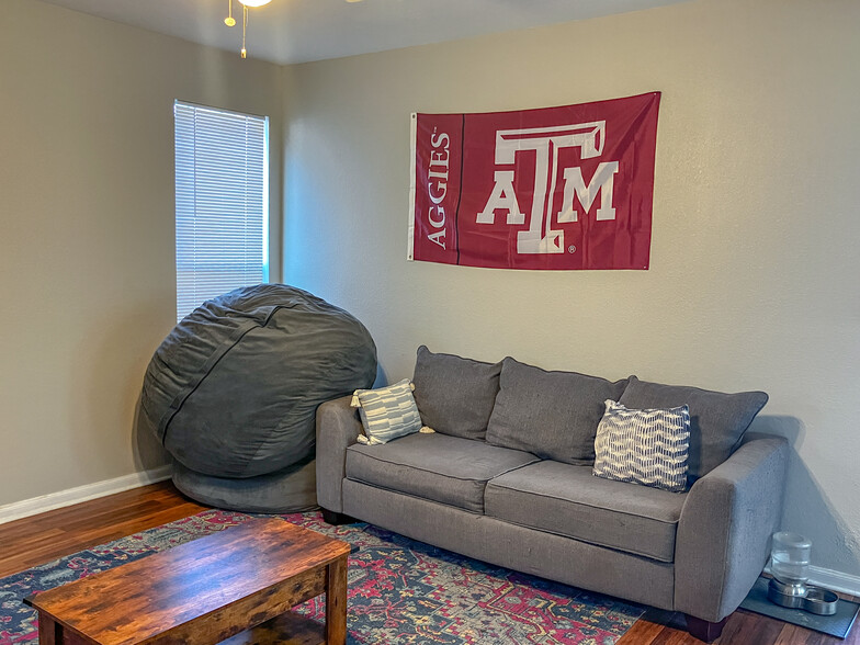 shared living area furnished by other roommates - 2929 McLaren Dr
