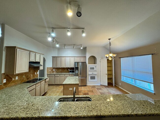 Building Photo - Ready For Move In! A Must See in Rogers Ranch - 4 Bedroom 2 Bath with Custom Features