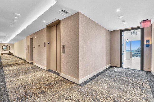 Building Photo - Stunning High-Rise Condo with Ocean Views | Prime Beach Location