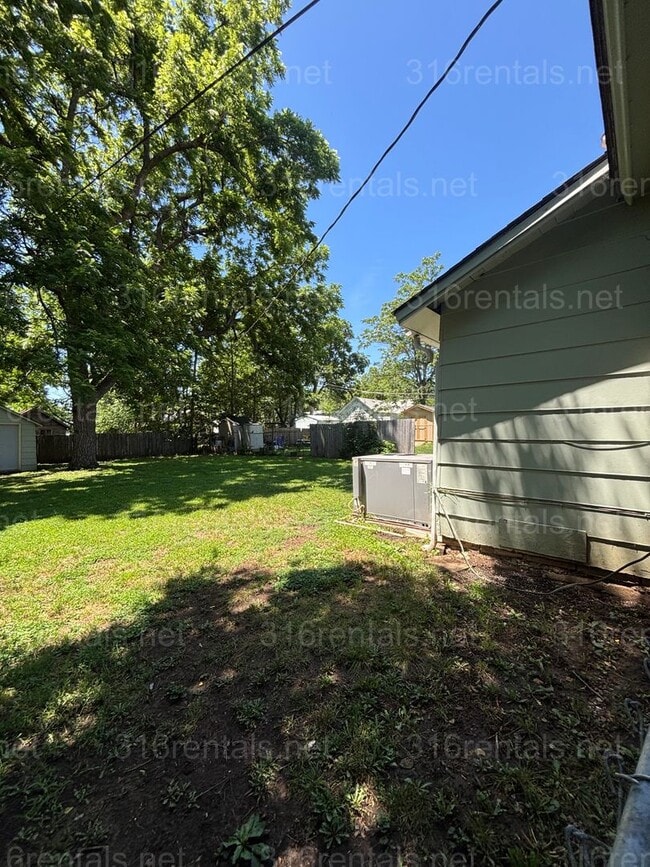 Building Photo - Two bed one bath fenced in yard house available now