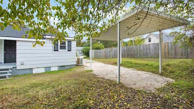 Backyard with covered outdoor area—great for relaxing or outdoor use. - 520 Commonwealth St