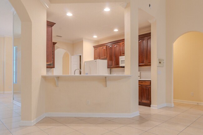 Building Photo - Spacious 5BR Home in Falcon Trace | 3-Car Garage | Screened Patio | Resort-Style Amenities Rent: ...