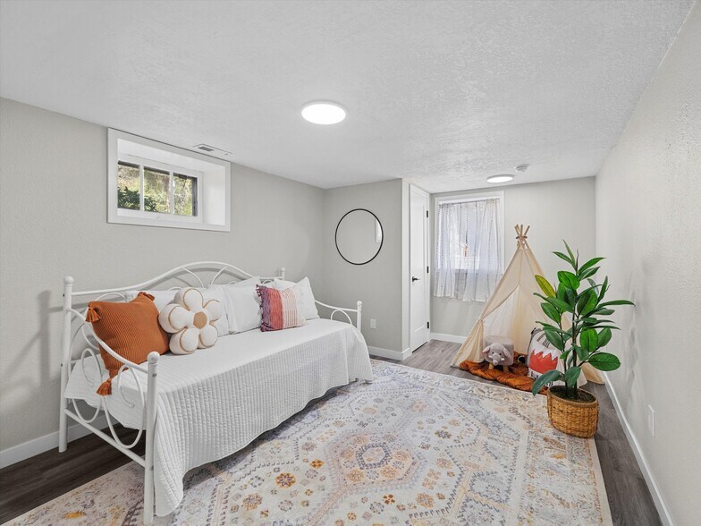 Each of the downstairs bedrooms is large. - 9835 SW 80th Ave