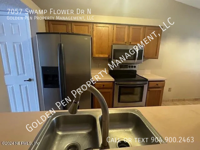 Building Photo - 7057 Swamp Flower Dr N