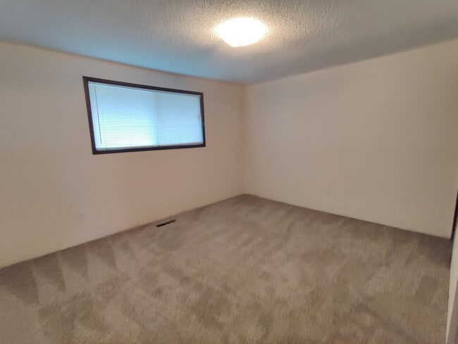Building Photo - Duplex with garage and fenced yard and upd...