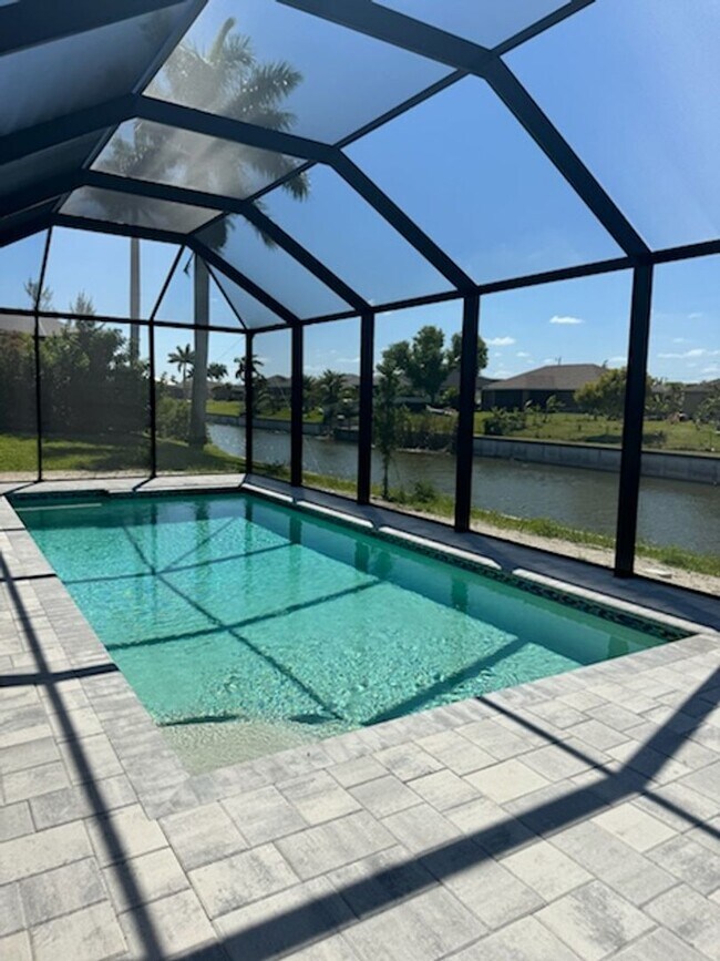 Building Photo - Move In Special! Pool Home with Canal View