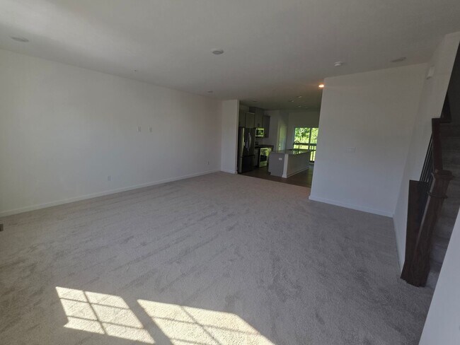 Building Photo - Brand-new townhome with modern finishes, flexible living space, and low-maintenance living.