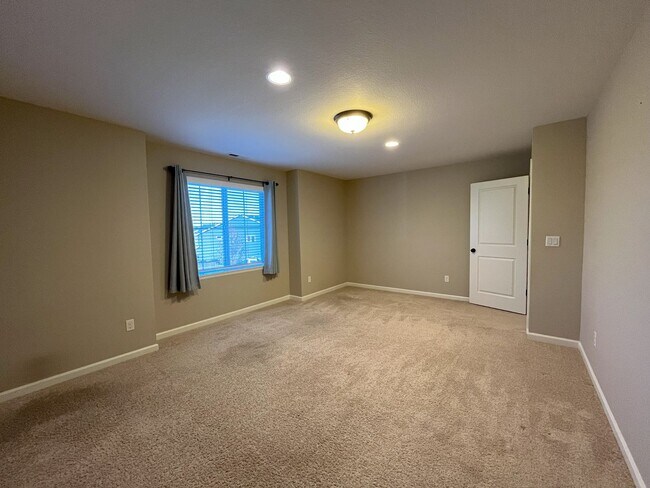Building Photo - Spacious 4-Bedroom + Bonus Room with Modern Kitchen, Solar Panels & Private Fenced Backyard!