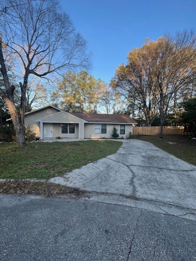 Building Photo - 3/2  home fenced in backyard located acros...