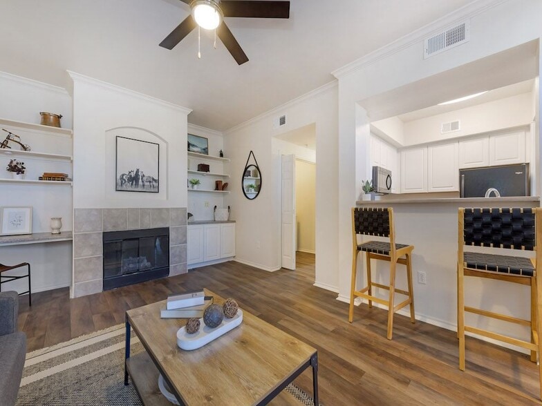 Living Room with a Fireplace at Trailside - Trailside Apartments