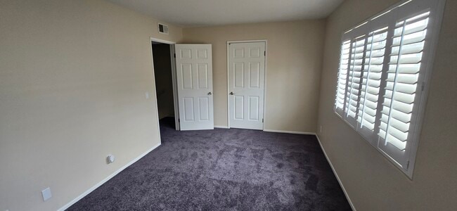 2nd Bedroom with walk-in closet. Carpet color is Steel Gray - 14365 Foothill Blvd