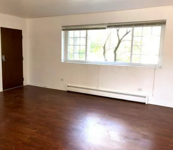 Front room with view of trees and courtyard. - 417 W Miner St