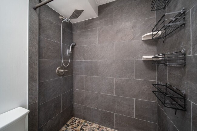 Building Photo - Upgraded Fully Furnished Condo w/ Assigned...