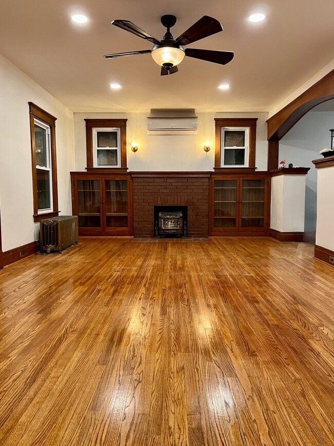 Large Living Room with Hardwood floors and built-in cabinets. A/C with Remote - 61 Hirschfield Dr