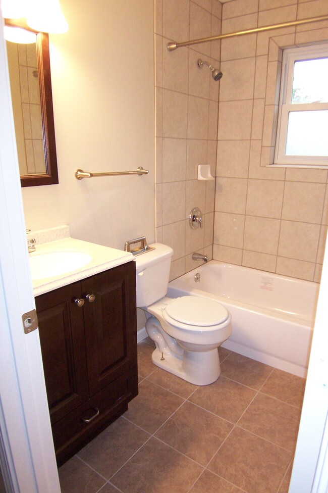 Full bath upstairs with new tile shower - 4773 Lorraine Ave