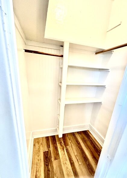 Large, walk in closet with built/in shelving and lots of storage! - 601 J Street