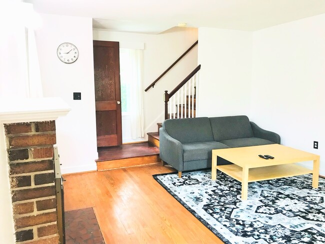 Living room: Couch & coffee table provided - 4806 Cherokee St