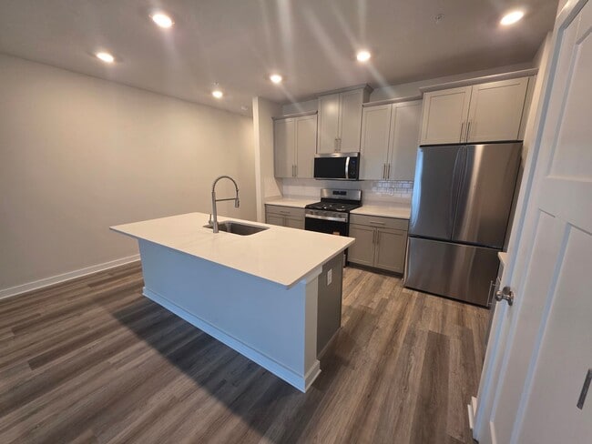 Building Photo - Luxury 4-Bedroom Townhome with Finished Walkout Basement & River Views