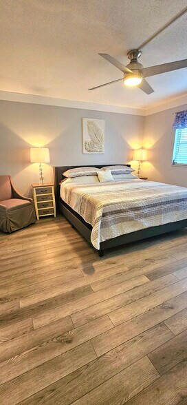 Large master bedroom with king sized bed & 65 inch smart t v - 8740 Lueck Ln