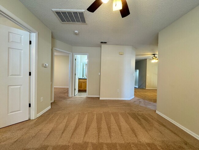 Building Photo - Spacious 4-Bedroom Home with Private Pool and Modern Comforts