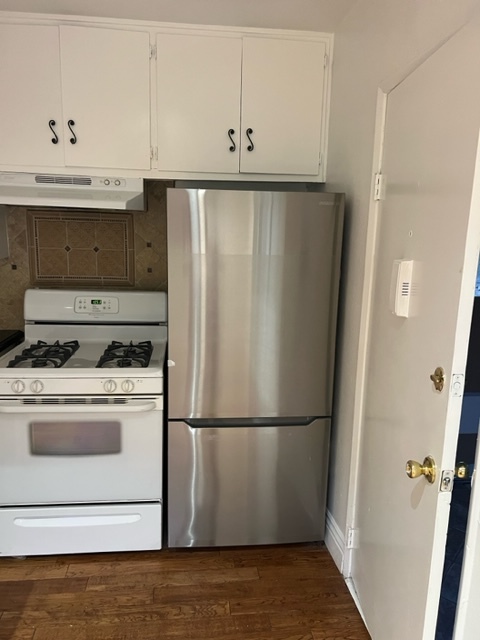 Large size, stainless steel, refrigerator, and stove. - 5545 1/2 Allott Ave