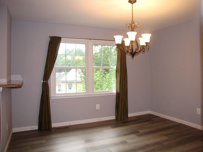 Building Photo - Beautifully updated brick end-unit townhou...
