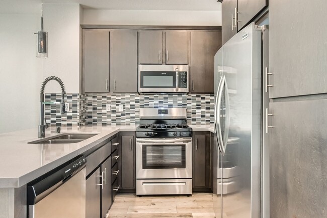 Building Photo - Stylish Three-Story Townhome with Private Courtyard & Pool Access