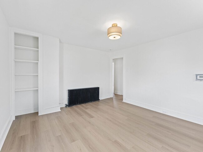 Building Photo - Renovated 3-Bedroom Apartment with Bonus Finished Attic & Spacious Shared Backyard