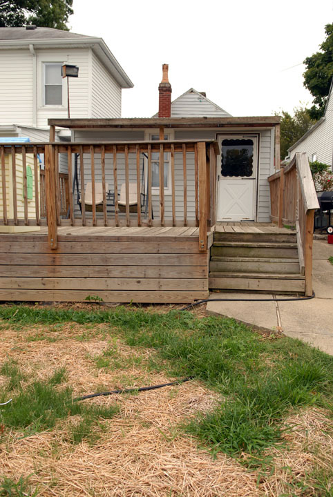 This is an old picture of the backyard. The deck has been rebuilt & there is a small overhang - 1103 Charles St