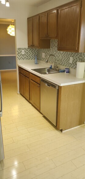 Kitchen with dishwasher, microwave, oven / cook top, and refrigerator - 8101 Needwood Rd