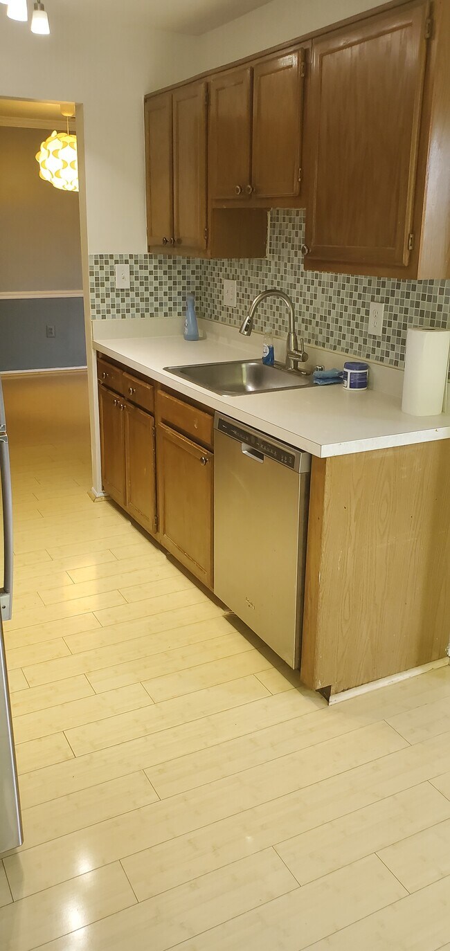 Kitchen with dishwasher, microwave, oven / cook top, and refrigerator - 8101 Needwood Rd