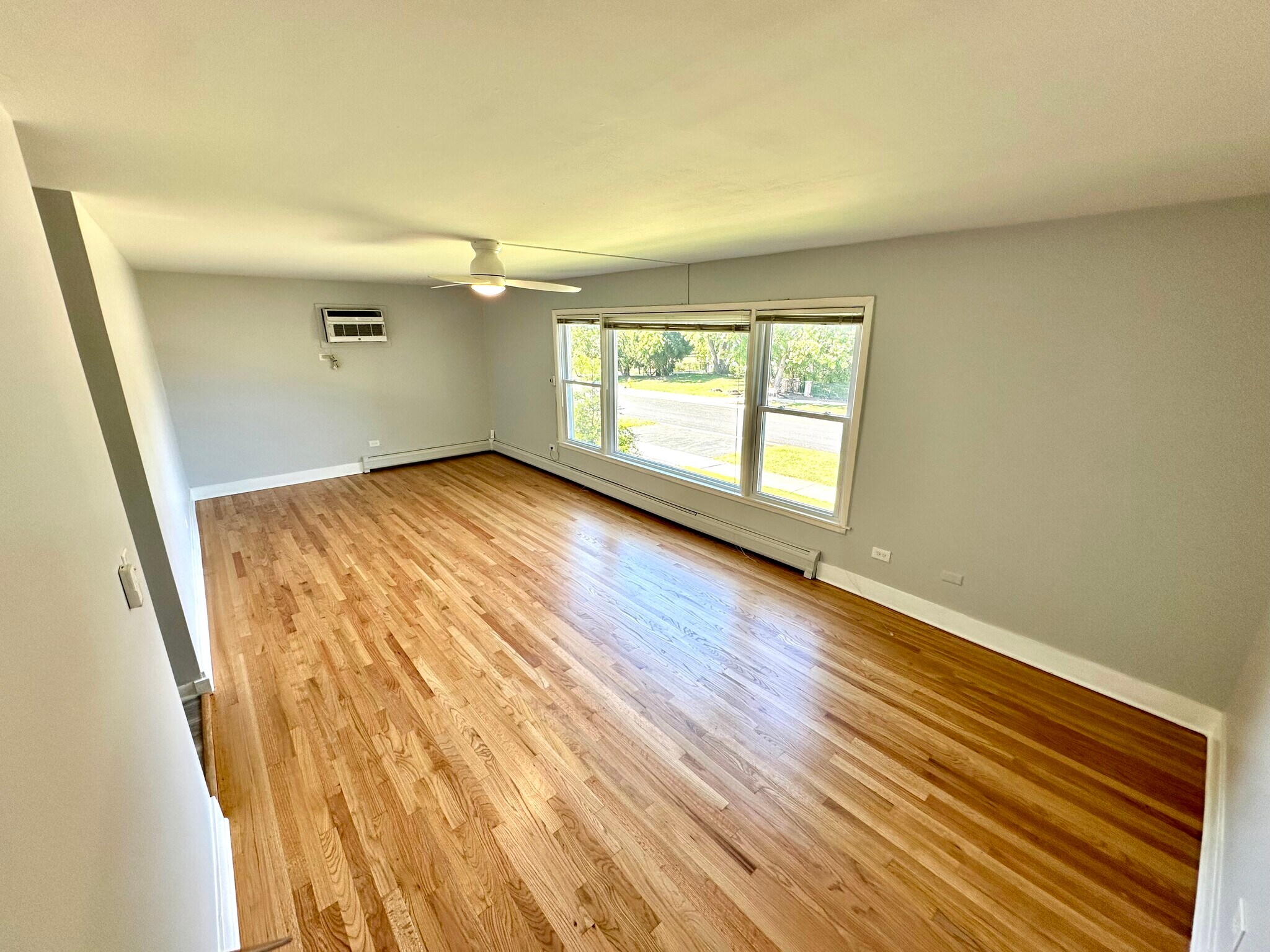 Large picture window and hardwood floor - 671 56th St
