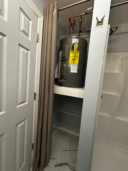 extra storage on the bottom half, really convenient for storing extra linens or bathroom supplies - 388 S Main St