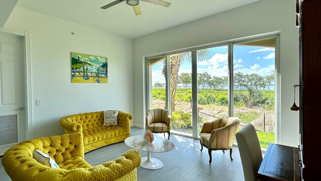 Sunroom and Backyard Water views - 28 Harbour Isle Dr W