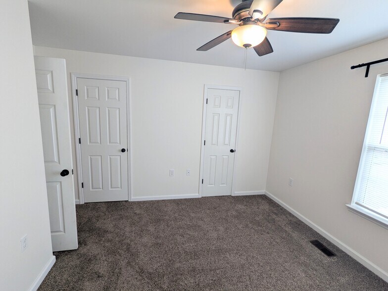 Master bedroom with closet and bathroom doors - 2237 Spring Meadow Ln SE