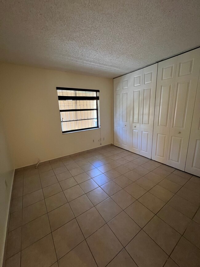 Bedroom downstairs with oversized double closets - 1424 SW 131st Place Cir E