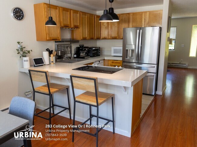 Building Photo - Two Bedroom Townhouse with Private Patio and Community Pool