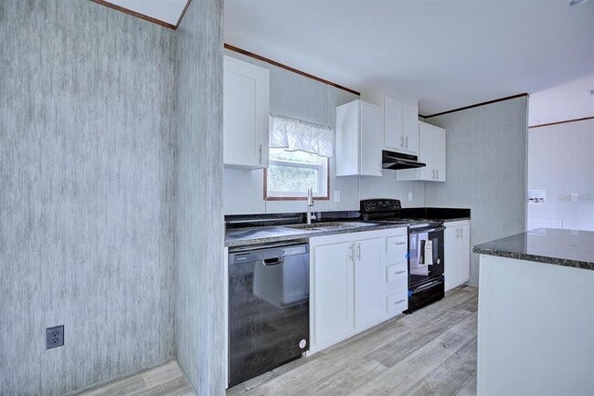 Building Photo - 8595 NW 13th Ct