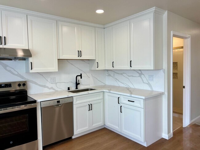 Building Photo - Light, bright & all NEW inside. Beautiful upgrades in this naturally bright 2 bd, 1 ba unit with ...
