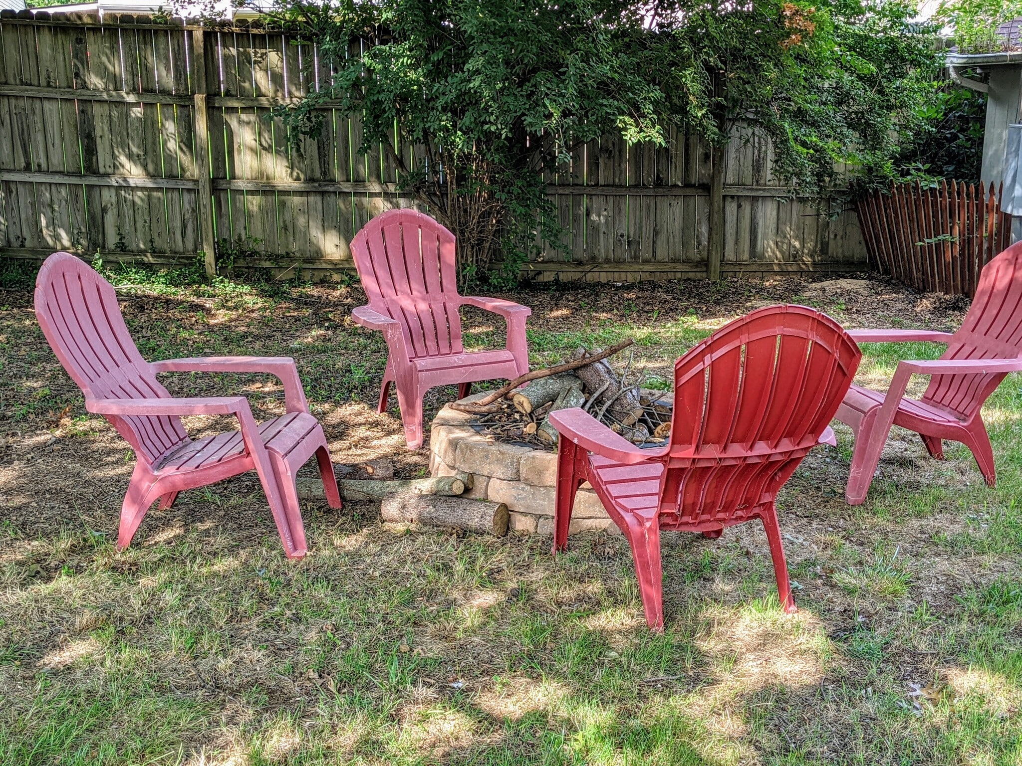 Backyard with firepit and Adirondack Chairs for relaxing. - 1649 Summerhill Dr
